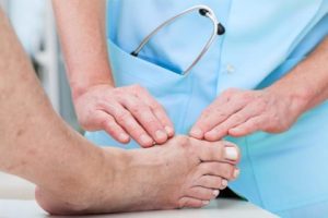 A podiatrist examines a bunion