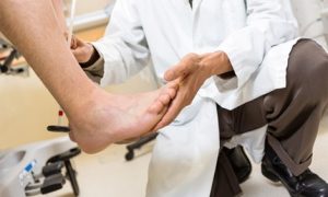 Doctor examines the foot and ankle