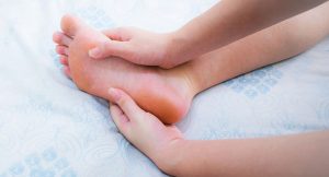It may indicate peripheral neuropathy if your feet feel as if they are covered in wax